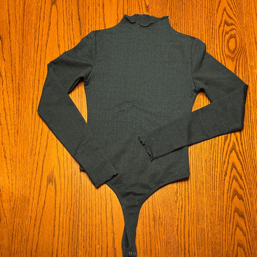 Women’s green bodysuit with mock neck